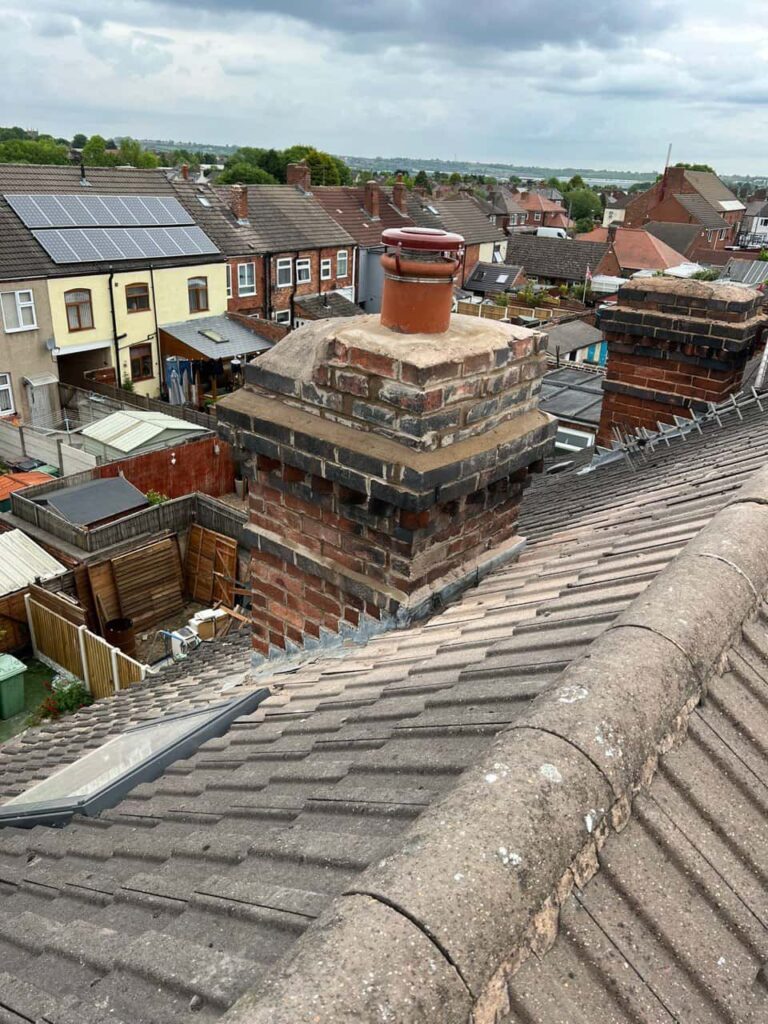 This is a photo taken from a roof which is being repaired by Mildenhall Roofing Repairs, it shows a street of houses, and their roofs