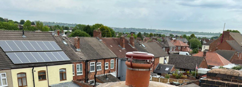 This is a photo taken from a roof showing the hip tiles which have been removed and are just about to be repaired